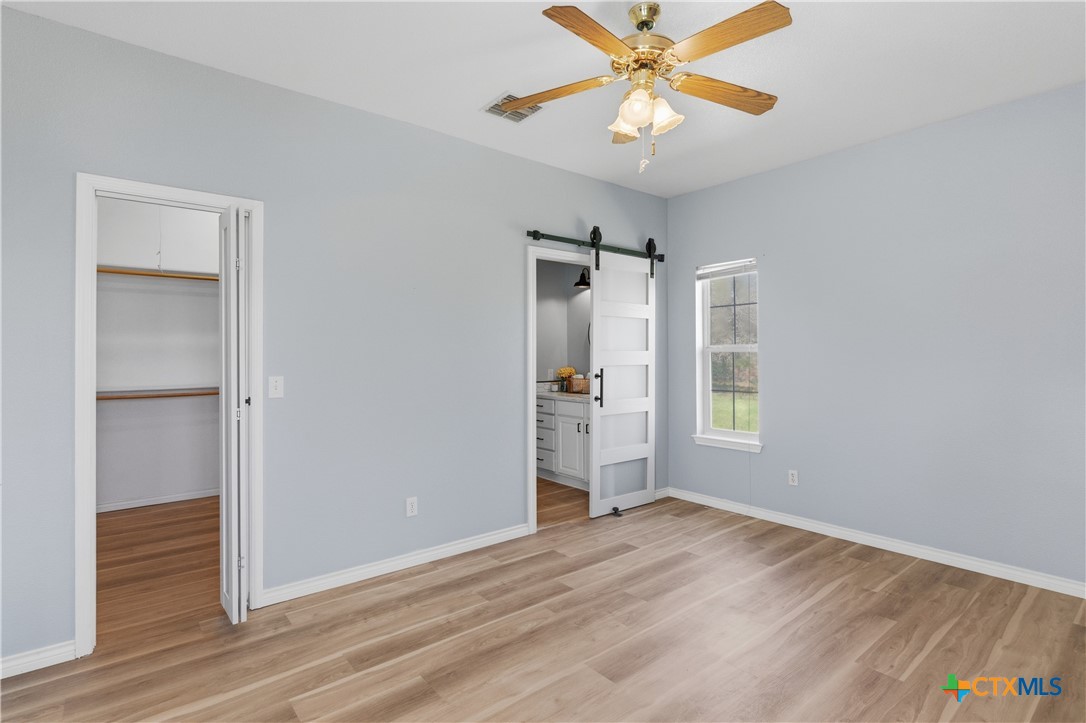 155 Guadalupe Ranch Lane Seguin, TX 78155 - Photo 35 of 48 a view of an empty room with window and wooden floor