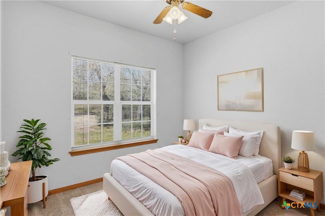 155 Guadalupe Ranch Lane Seguin, TX 78155 - Photo 36 of 48 a bedroom with bed and a large window