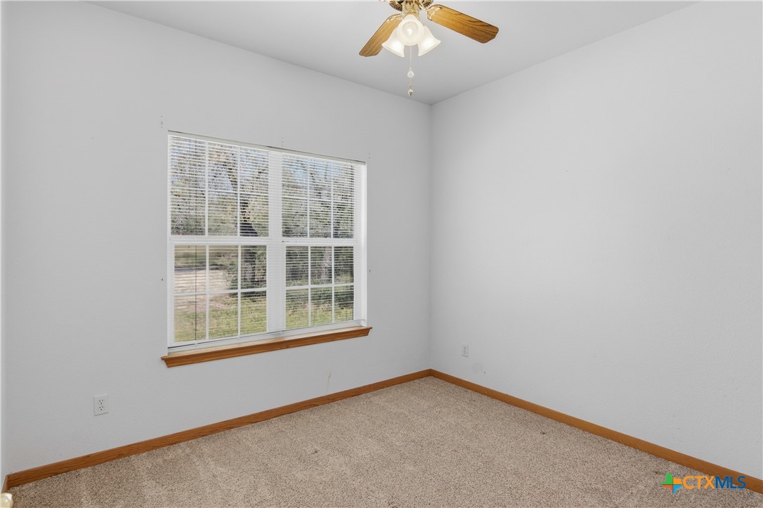 155 Guadalupe Ranch Lane Seguin, TX 78155 - Photo 38 of 48 an empty room with a window
