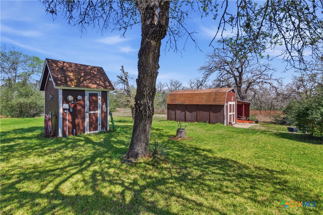 155 Guadalupe Ranch Lane Seguin, TX 78155 - Photo 9 of 48 a view of a house with a backyard space and tree