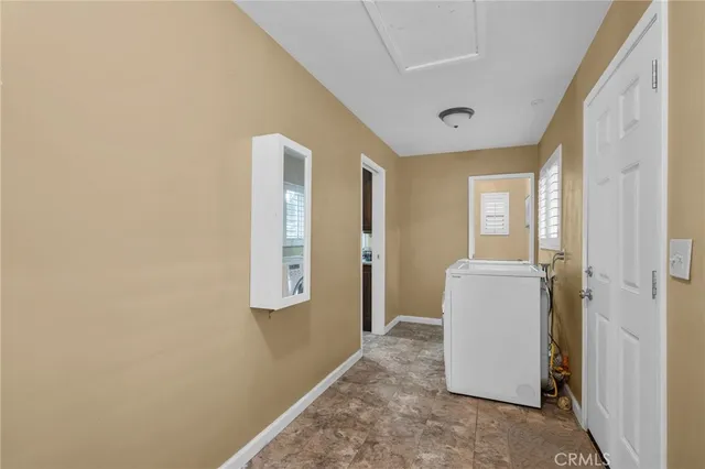 a view of a hallway with front door