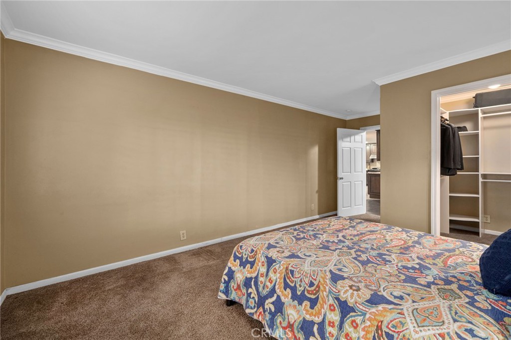 7247 Linden Lane Rancho Cucamonga, CA 91784 - Photo 20 of 51 a bedroom with a bed and a cabinets