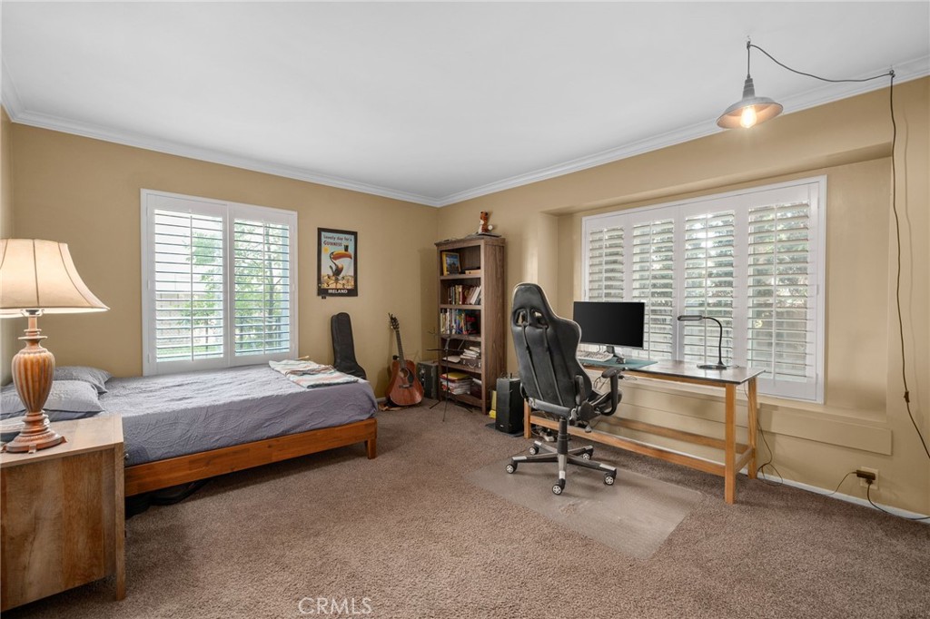 7247 Linden Lane Rancho Cucamonga, CA 91784 - Photo 24 of 51 a bedroom with bed and a window