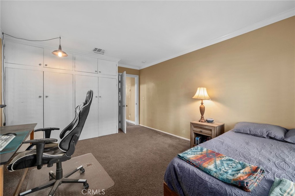 7247 Linden Lane Rancho Cucamonga, CA 91784 - Photo 25 of 51 a bed room with furniture and a lamp