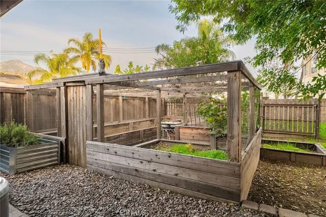 a wooden bench sitting in front of a house