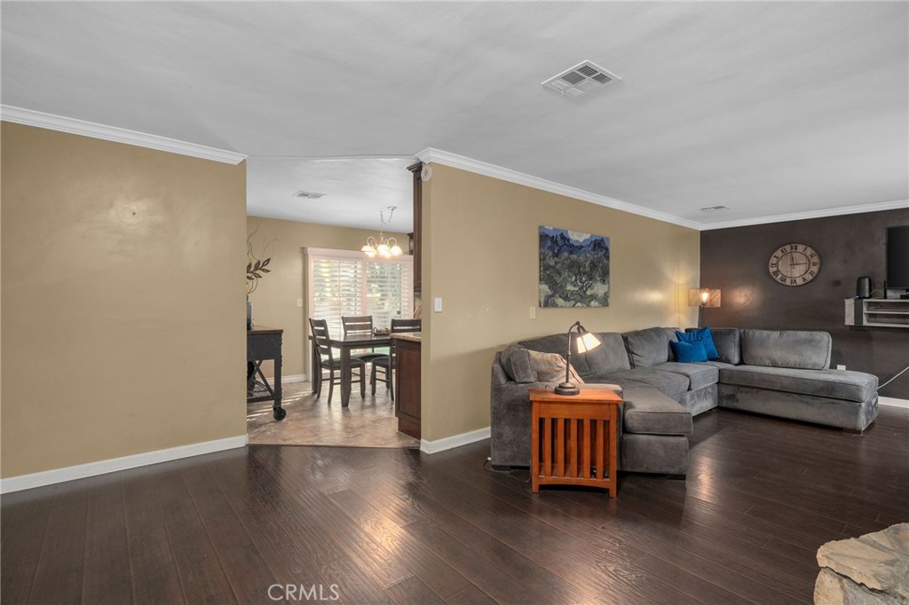 7247 Linden Lane Rancho Cucamonga, CA 91784 - Photo 7 of 51 a living room with furniture and a wooden floor