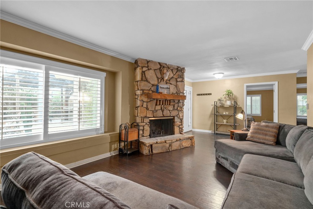 7247 Linden Lane Rancho Cucamonga, CA 91784 - Photo 10 of 51 a living room with furniture large window and a fireplace