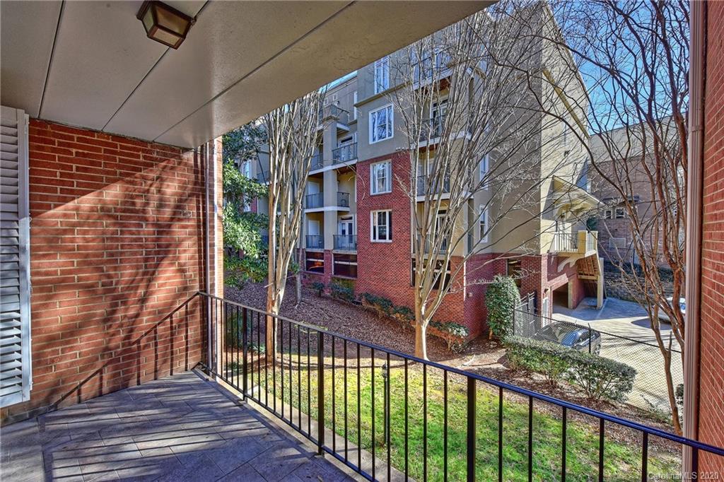 400 Queens Road, Unit D1 Charlotte, NC 28207 - Photo 18 of 23 a view of a brick building with many windows
