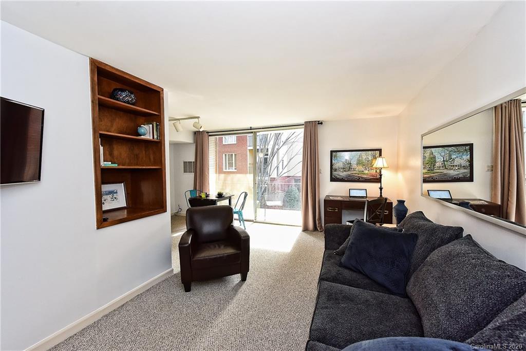 400 Queens Road, Unit D1 Charlotte, NC 28207 - Photo 6 of 23 a living room with furniture or couch and a flat screen tv