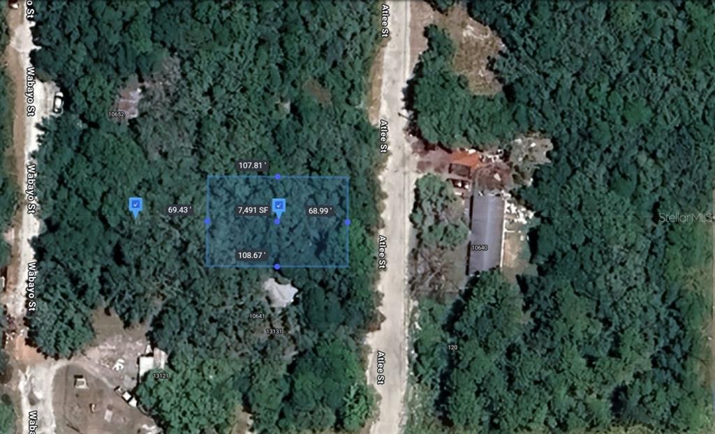 Atlee New Port Richey, FL 34654 - Photo 9 of 9 an aerial view of a house with yard