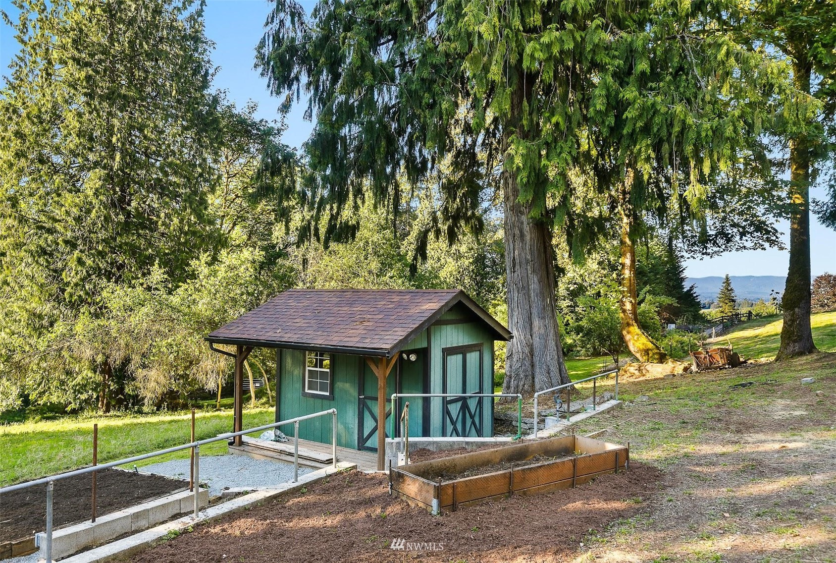 15012 High Bridge Road Monroe, WA 98272 - Photo 33 of 40 a view of a house with backyard and a tree
