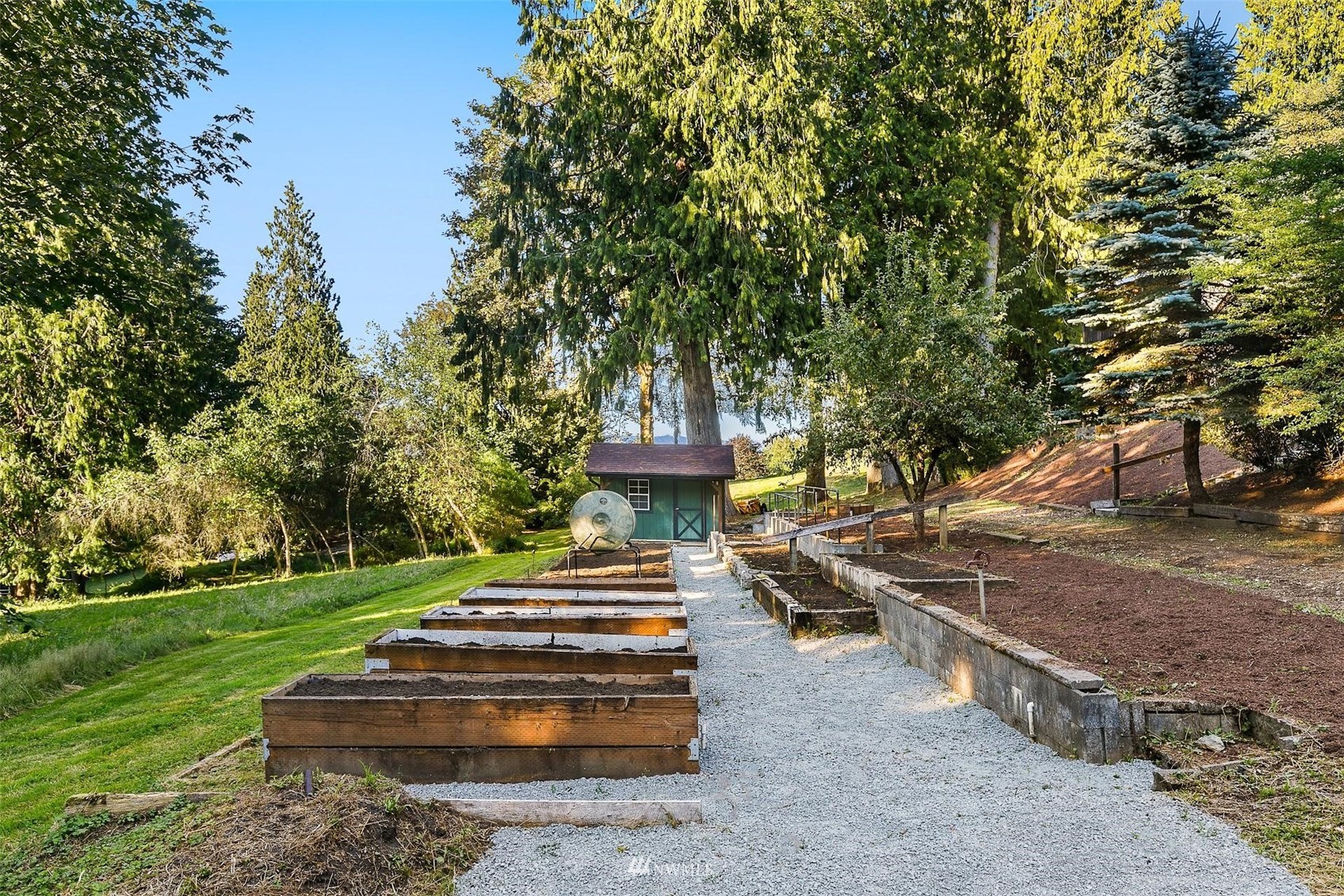 15012 High Bridge Road Monroe, WA 98272 - Photo 36 of 40 a front view of a house with a garden