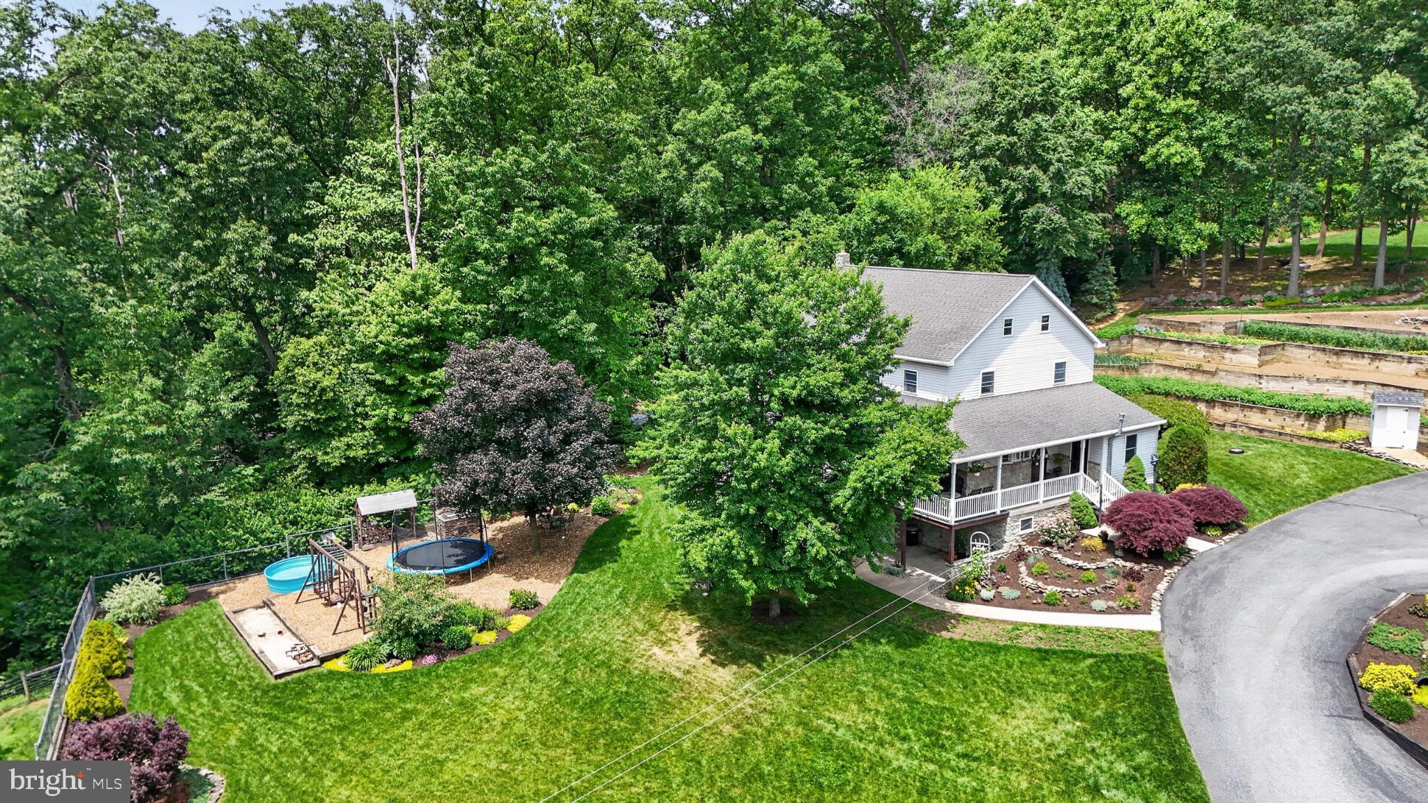 257 Hill Road New Holland, PA 17557 - Photo 17 of 94 Serene home nestled in lush greenery.