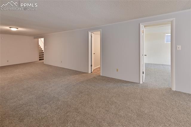 15445 Raton Road Colorado Springs, CO 80921 - Photo 29 of 46 Basement Family Room and Bedroom #4 and bathroom