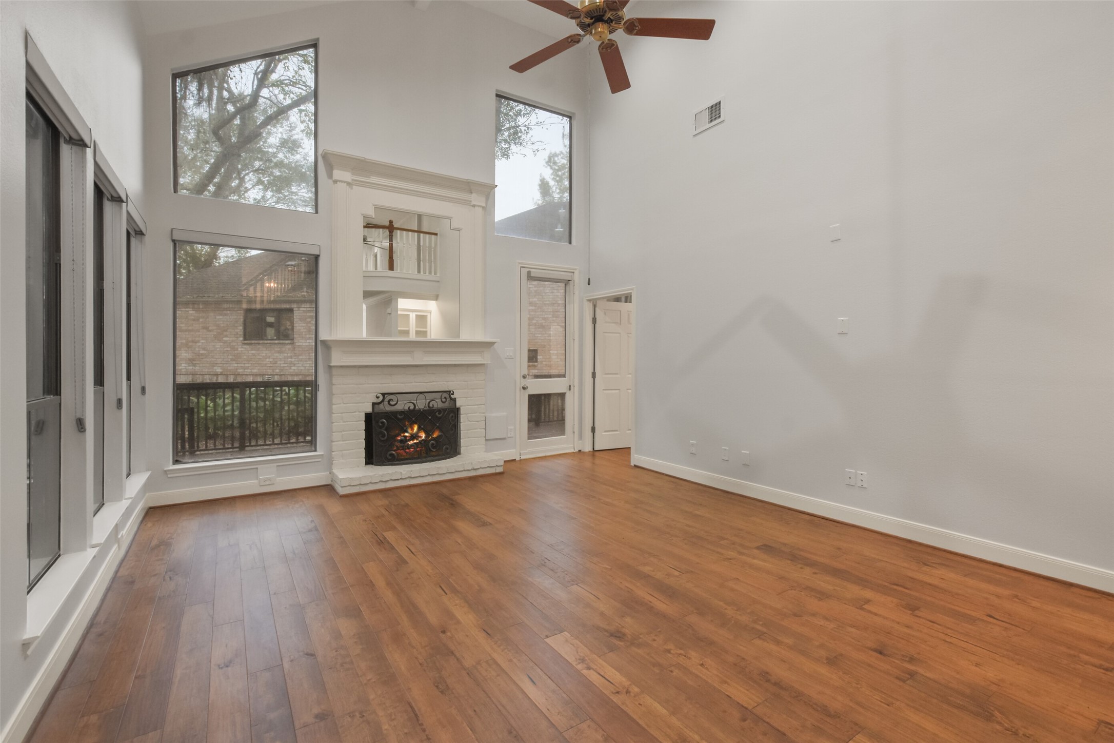 12859 Kingsbridge Lane Houston, TX 77077 - Photo 4 of 36 a view of an empty room with a fireplace and a window