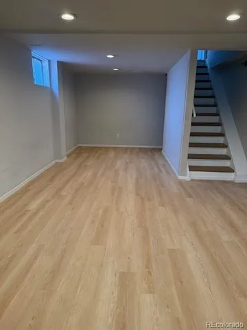 a view of an empty room with stairs