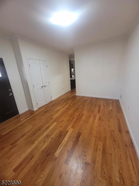 452 Fulton Street, Unit 1 Elizabeth Port, NJ 07206 - Photo 11 of 12 a view of empty room with wooden floor