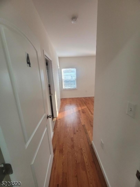 452 Fulton Street, Unit 1 Elizabeth Port, NJ 07206 - Photo 6 of 12 a view of entryway with wooden floor