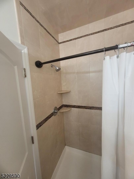 452 Fulton Street, Unit 1 Elizabeth Port, NJ 07206 - Photo 7 of 12 a bathroom with a shower