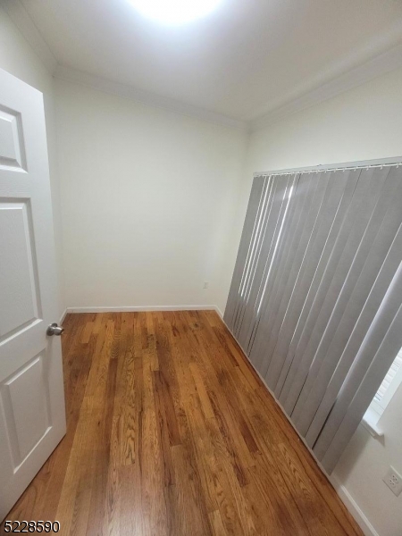 452 Fulton Street, Unit 1 Elizabeth Port, NJ 07206 - Photo 9 of 12 a view of a room with wooden floor