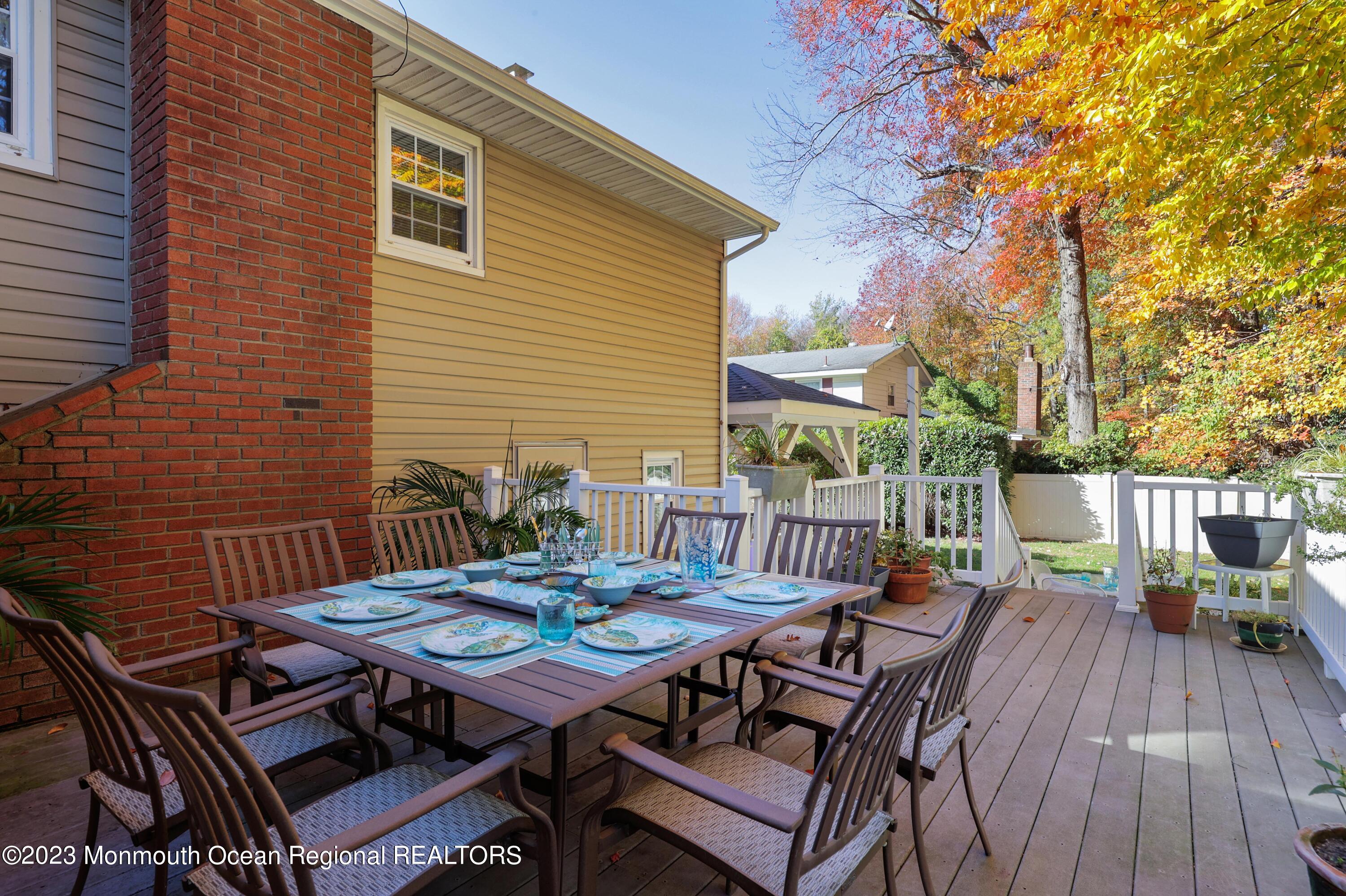 2600 Logan Road Asbury Park, NJ 07712 - Photo 15 of 36 a view of a patio with a table and chairs