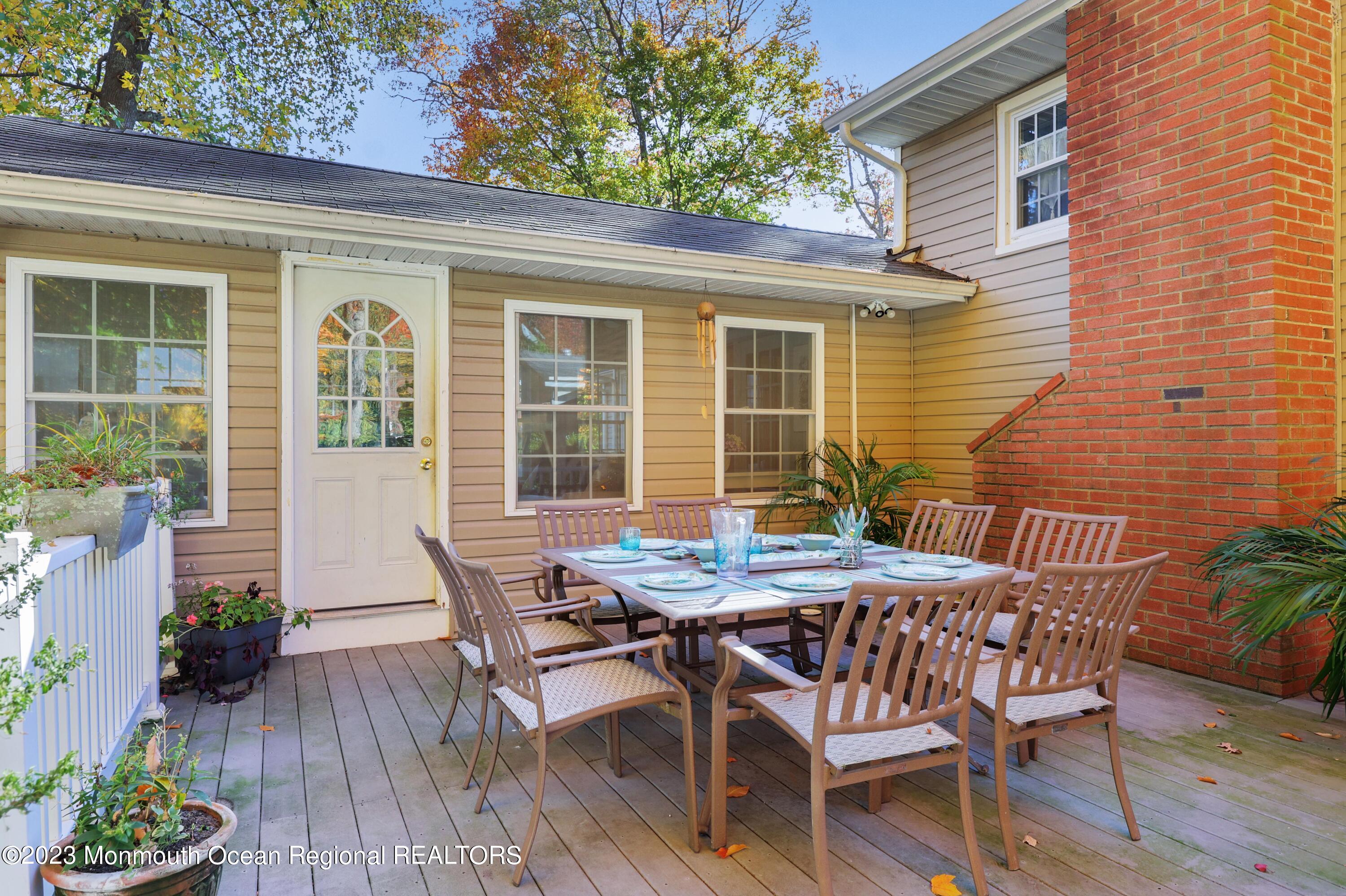 2600 Logan Road Asbury Park, NJ 07712 - Photo 16 of 36 a view of a wooden chairs and table in the patio