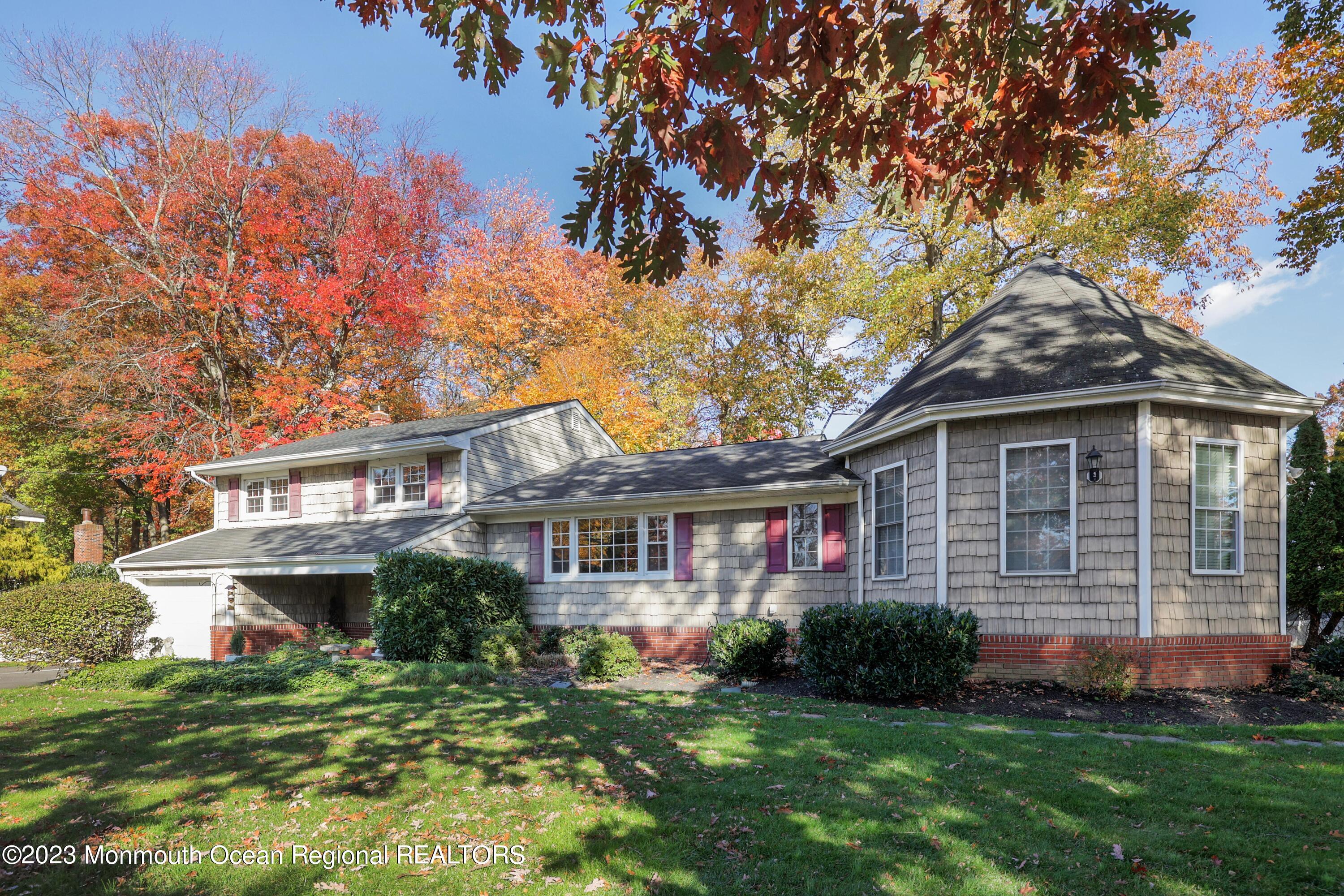 2600 Logan Road Asbury Park, NJ 07712 - Photo 2 of 36 a front view of a house with a garden