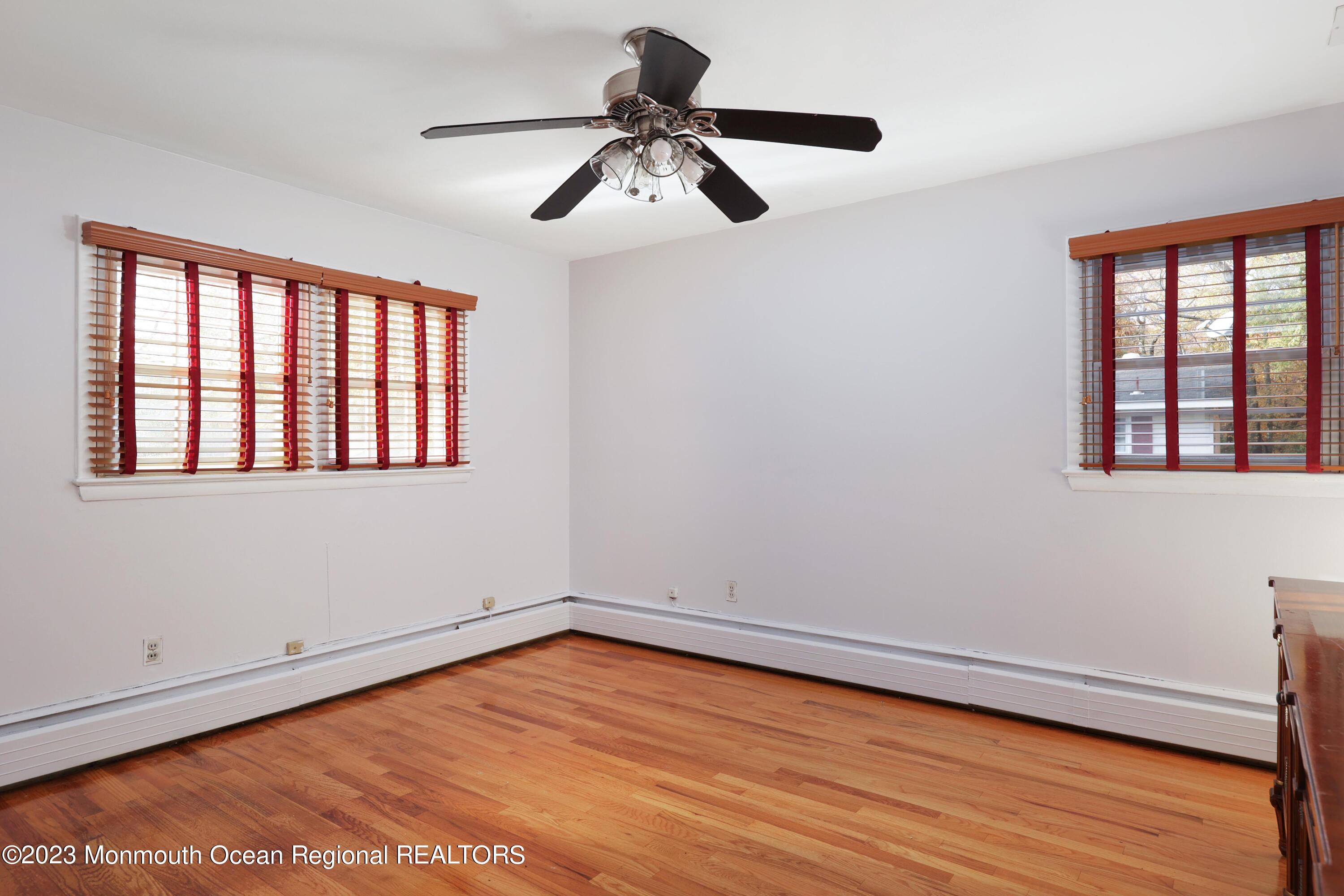 2600 Logan Road Asbury Park, NJ 07712 - Photo 24 of 36 a view of empty room with wooden floor and fan