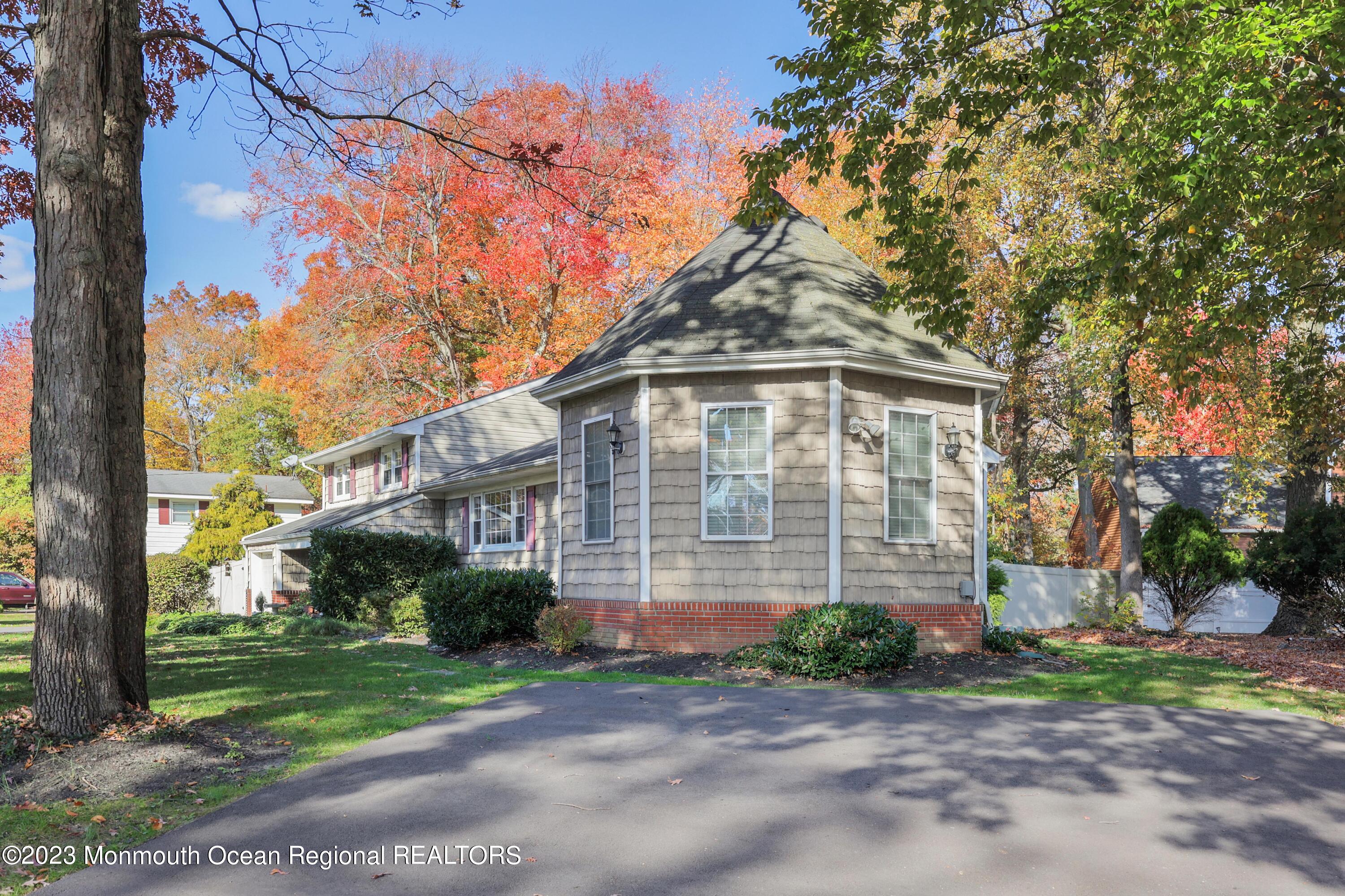 2600 Logan Road Asbury Park, NJ 07712 - Photo 33 of 36 a front view of a house with a garden