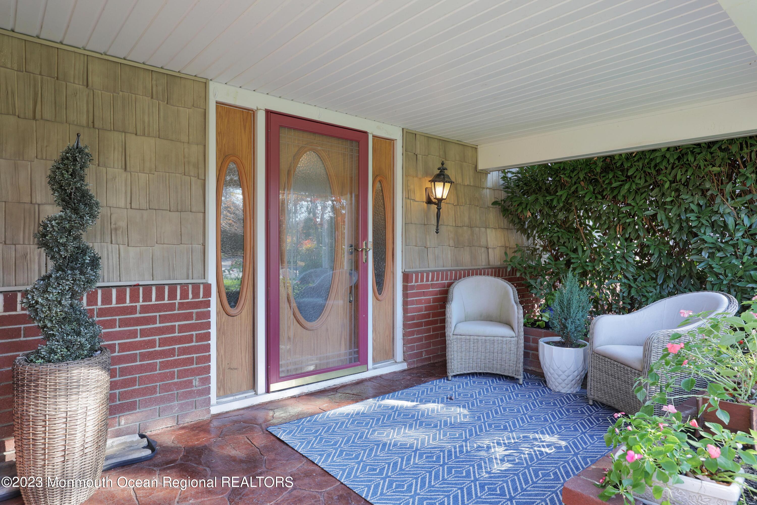 2600 Logan Road Asbury Park, NJ 07712 - Photo 4 of 36 a balcony with couch and a potted plant