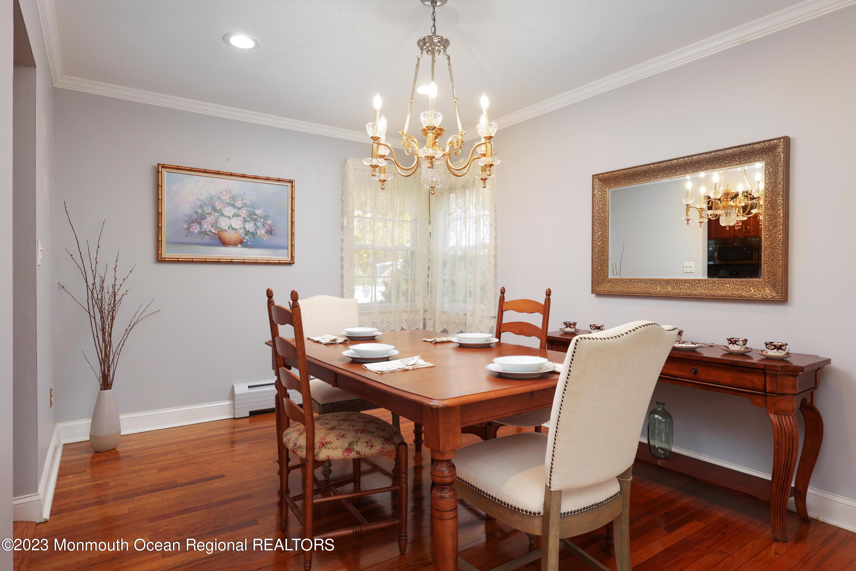2600 Logan Road Asbury Park, NJ 07712 - Photo 8 of 36 a view of a dining room with furniture and wooden floor