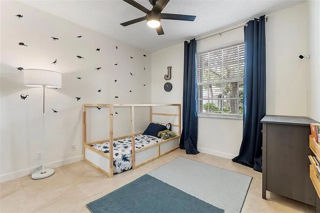 a bedroom with furniture and window