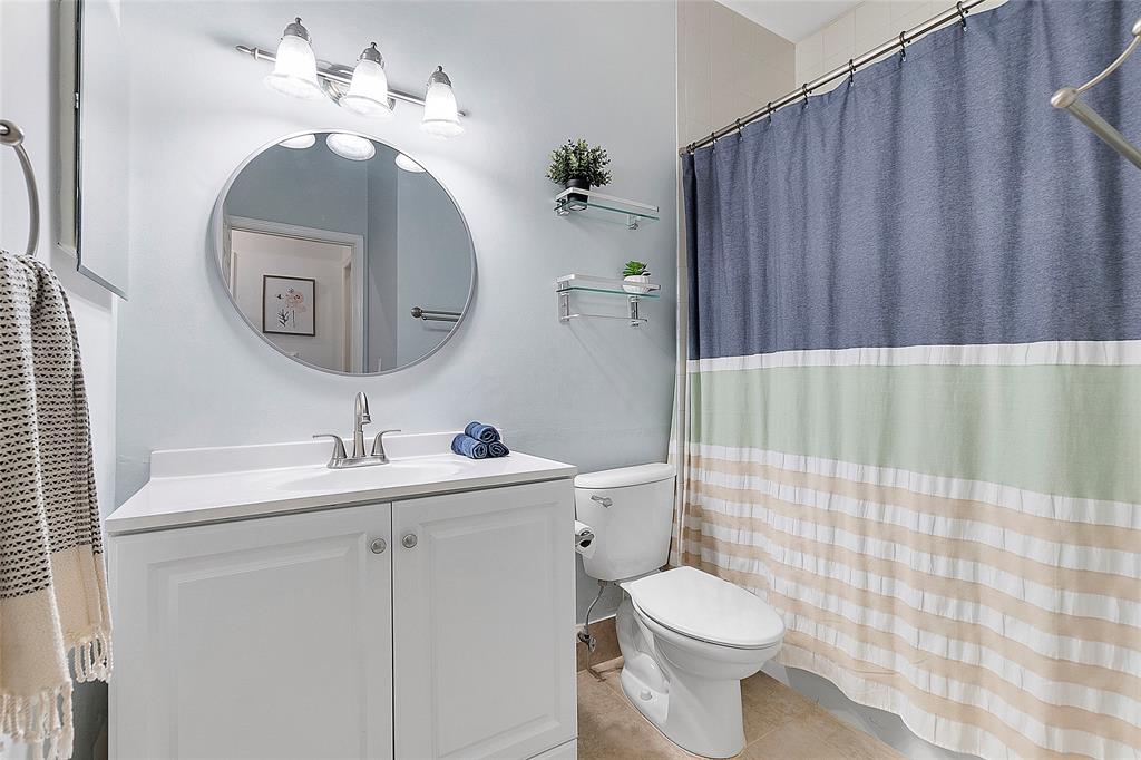 10650 Northwest 48th Street Coral Springs, FL 33076 - Photo 29 of 37 a bathroom with a toilet sink and mirror