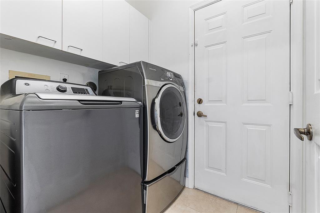 10650 Northwest 48th Street Coral Springs, FL 33076 - Photo 31 of 37 a utility room with dryer and washer