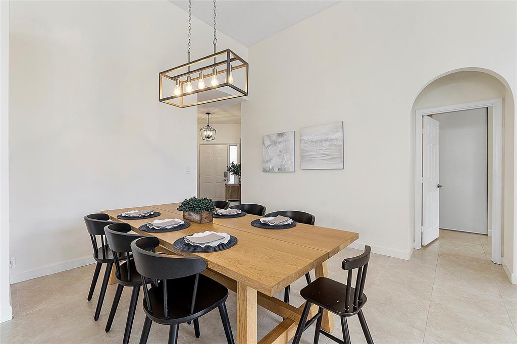 10650 Northwest 48th Street Coral Springs, FL 33076 - Photo 7 of 37 a view of a dining room with furniture and wooden floor