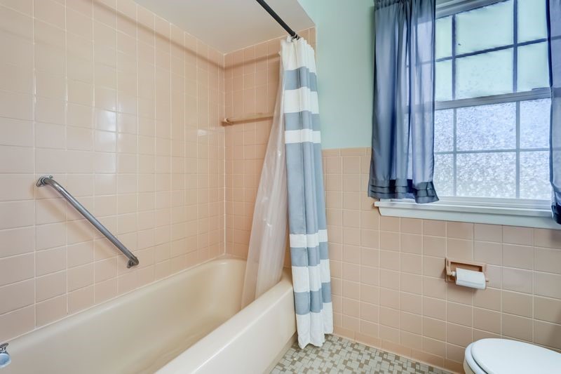 195 Kings Gate North Irondequoit, NY 14617 - Photo 18 of 49 Closer view of the tile shower surround and a glim