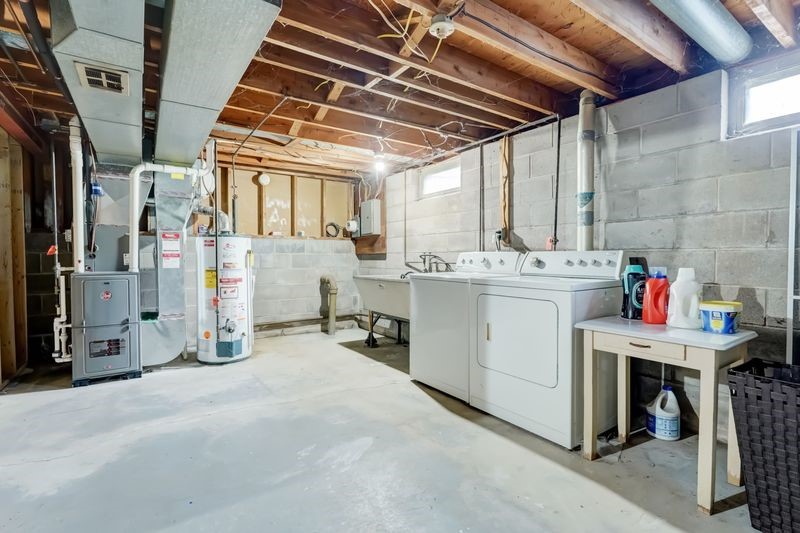 195 Kings Gate North Irondequoit, NY 14617 - Photo 32 of 49 Bone dry unfinished basement area with washer and