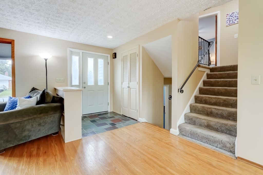 195 Kings Gate North Irondequoit, NY 14617 - Photo 4 of 49 A warm and welcoming entry foyer. (Hardwood under