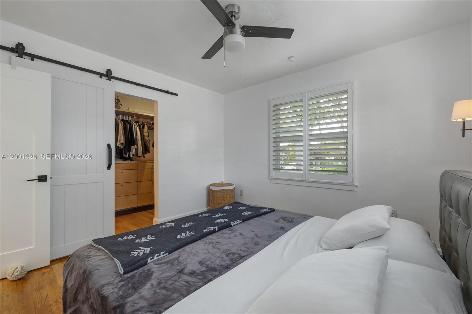 6382 Southwest 38th Street Miami, FL 33155 - Photo 20 of 41 a bedroom with a bed and wooden floor