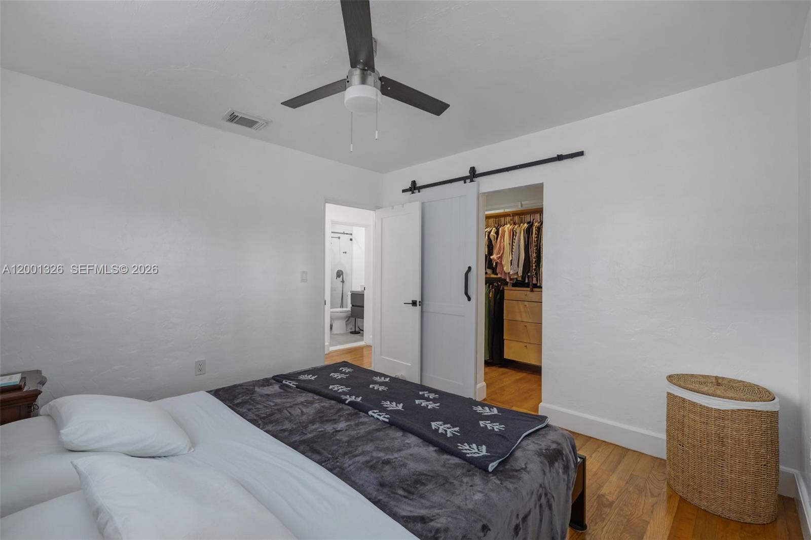 6382 Southwest 38th Street Miami, FL 33155 - Photo 21 of 41 a bedroom with a bed and a walk in closet