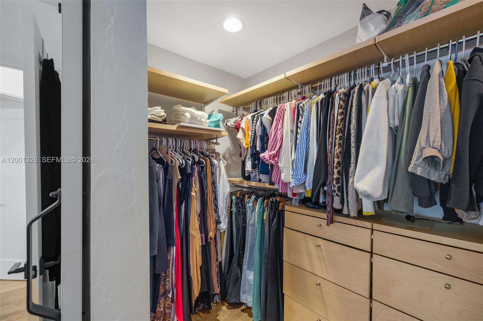 6382 Southwest 38th Street Miami, FL 33155 - Photo 23 of 41 a view of walk in closet with clothes