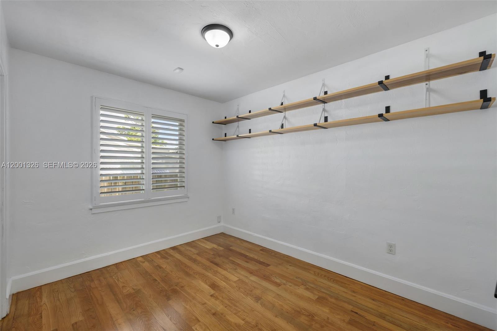 6382 Southwest 38th Street Miami, FL 33155 - Photo 24 of 41 a view of an empty room with a window