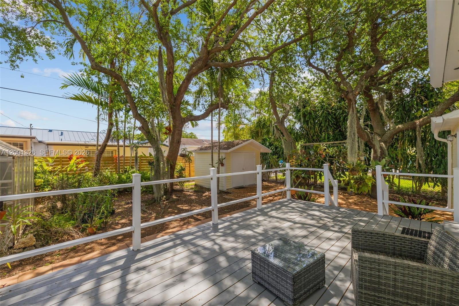6382 Southwest 38th Street Miami, FL 33155 - Photo 28 of 41 a backyard of a house with table and chairs