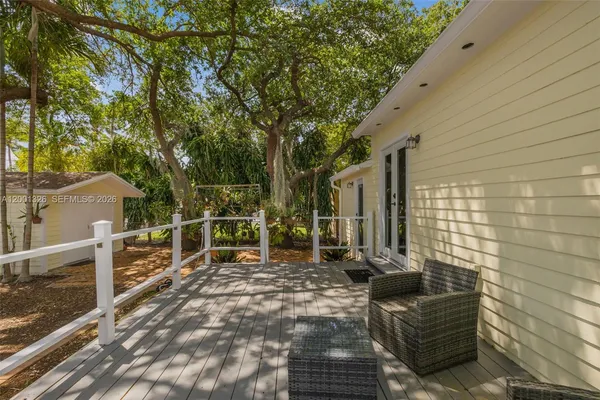 a view of two chairs in the balcony
