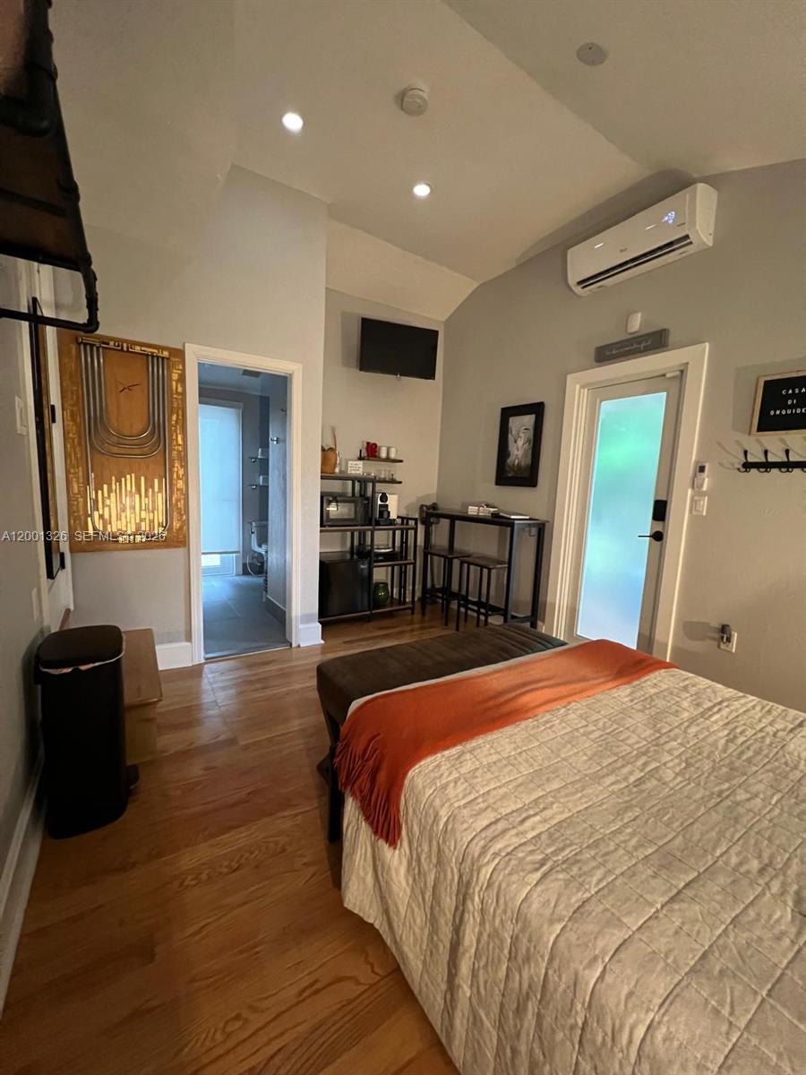 6382 Southwest 38th Street Miami, FL 33155 - Photo 37 of 41 a bed room with a bed and a television