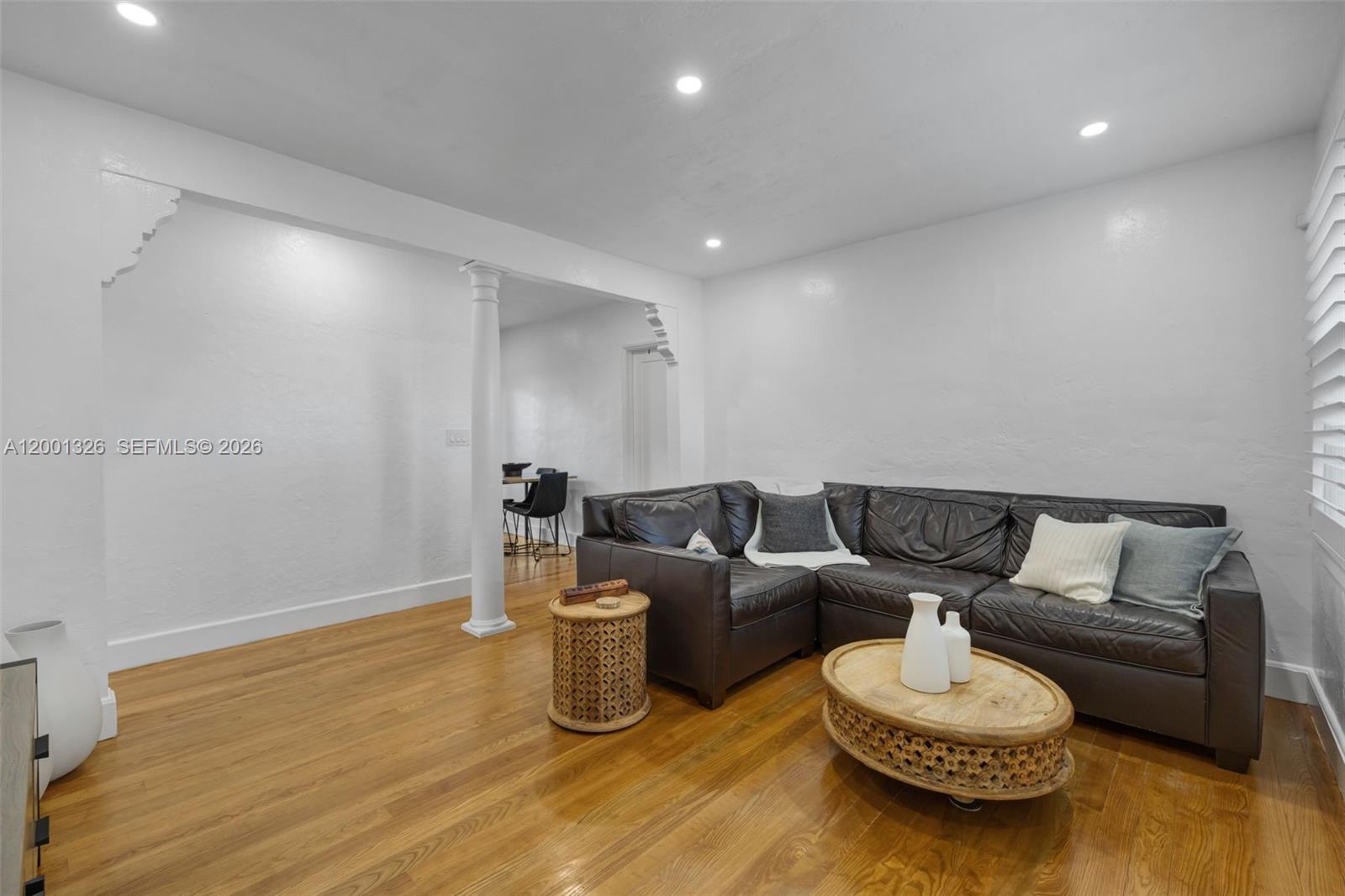 6382 Southwest 38th Street Miami, FL 33155 - Photo 9 of 41 a living room with furniture and a wooden floor