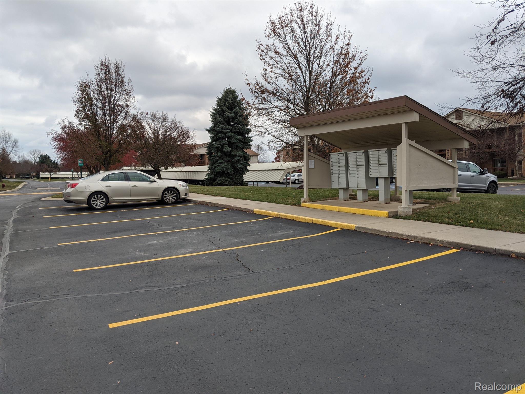 46218 Reedgrass Lane Belleville, MI 48111 - Photo 37 of 41 Guest parking and mail boxes across from your door