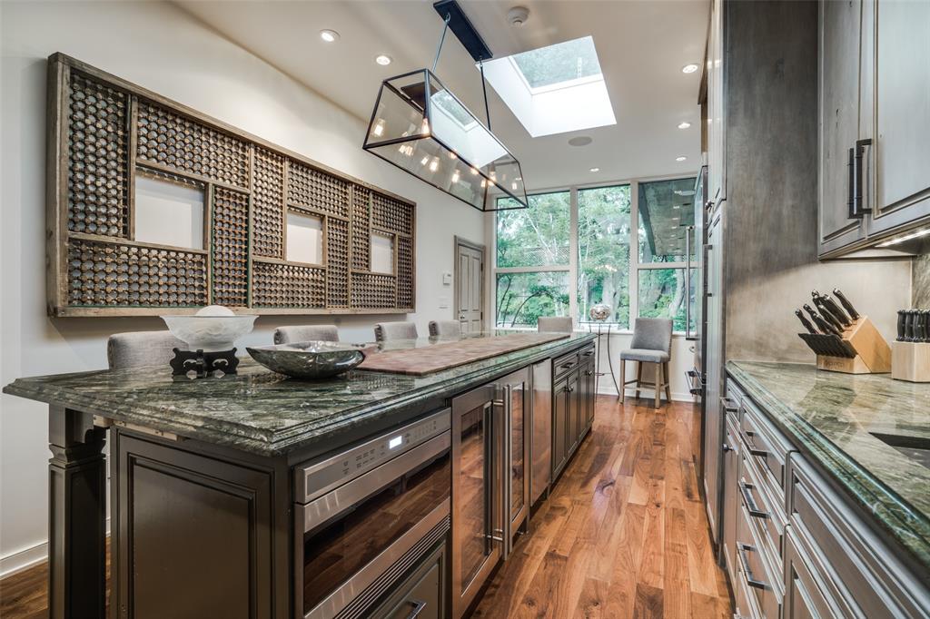 3610 Congress Avenue Dallas, TX 75219 - Photo 13 of 40 a kitchen with stainless steel appliances granite countertop a sink stove and cabinets