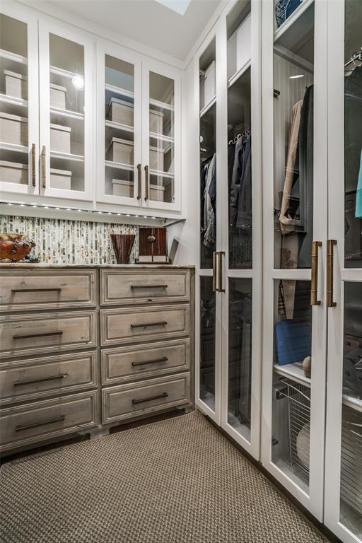 3610 Congress Avenue Dallas, TX 75219 - Photo 27 of 40 a view of walk in closet with empty racks