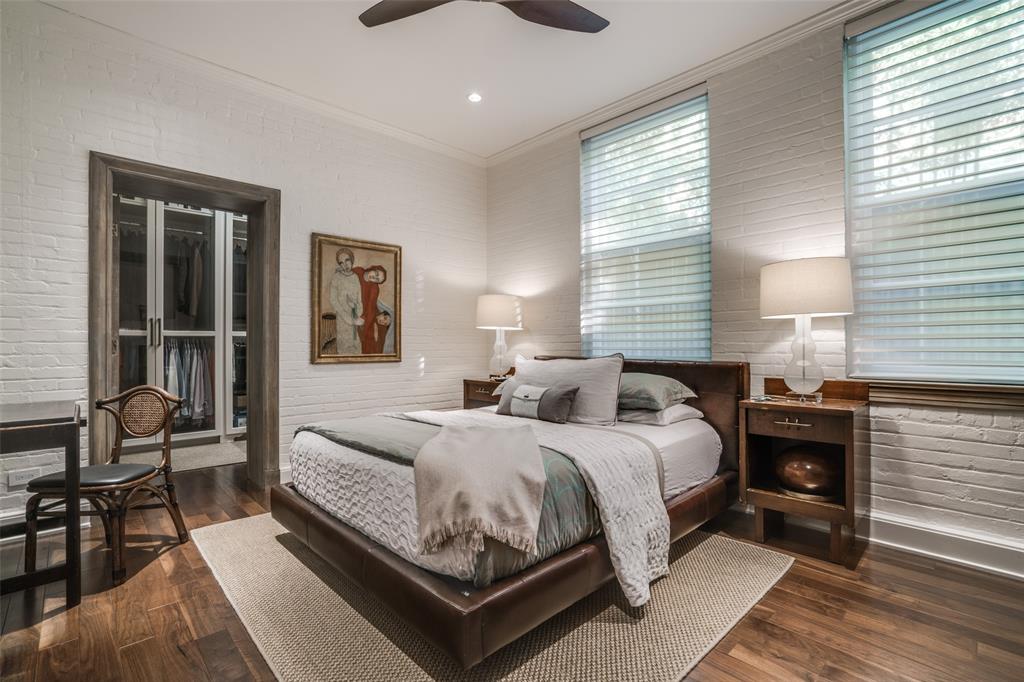 3610 Congress Avenue Dallas, TX 75219 - Photo 28 of 40 a bedroom with a bed and wooden floor